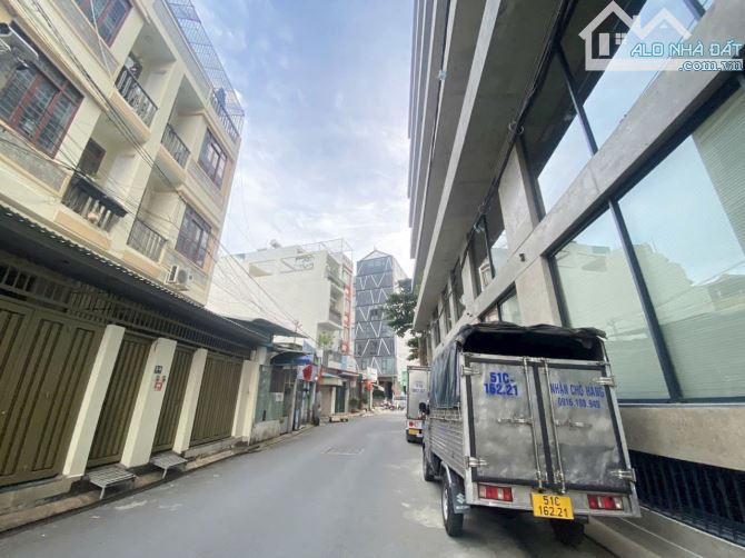 Tòa nhà CHDV Bạch Đằng,7m x 23m,góc 2 mặt hẻm lớn,18 phòng thu nhập 130tr/th chỉ 22,7ty - 4