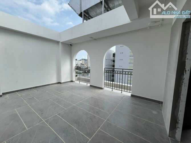 Tòa Building góc 3 MT Lê Quang Định Q.Bình Thạnh 67x20m - Hầm 9 tầng HĐT 300tr giá 55 tỷ - 5