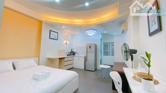 nhà 5 tầng thu nhập 50tr/tháng, hẻm xe hơi Nơ Trang Long, 10 phòng studio, giá 9.3 tỷ