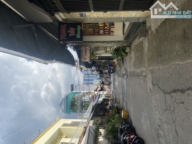 Nhà 2T ngay chợ lạc quang kinh doanh tốt tân thới nhất quận 12.(4.7x23) - 9.x tỷ - 2