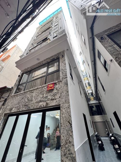 6 tầng thang máy mới mặt ngõ Trần Duy Hưng, kdoanh tốt, gần Phố, oto, 50m2. Giá 22.5 tỷ
