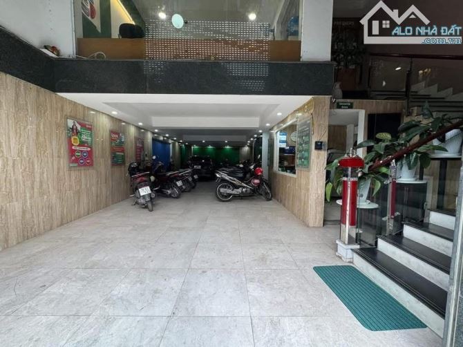 Toà Văn Phòng Hoàng Cầu quận Đống Đa 112m2 9Tầng MT7.8m-Ô Tô Tránh Kinh Doanh Đẹp