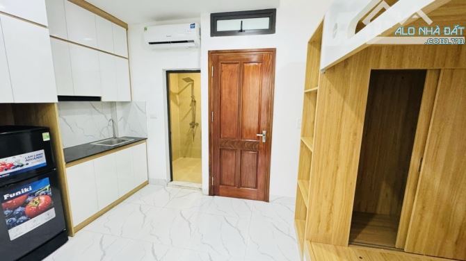 Bán nhà Trần Thái Tông, dt55m, mt5m, 7 tầng thang máy, gần ô tô, gần phố. - 2