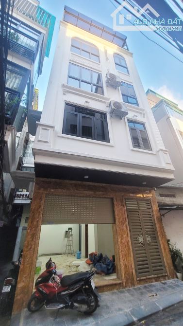 Bán Nhà Phố Tôn Đức Thắng, Đống Đa, Lô Góc 51m2, 6 Tầng Thang Máy, Gara ÔTô, KD, 19.x Tỷ
