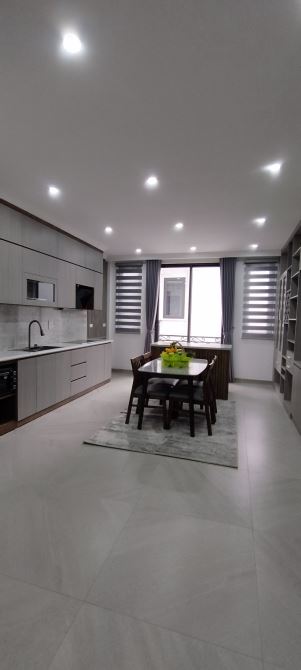 NGUYỄN KHÁNH TOÀN CẦU GIẤY 7 TẦNG THANG MÁY GARA OTO 15m RA PHỐ 40m MT 5.5m 13.8 Tỷ - 4