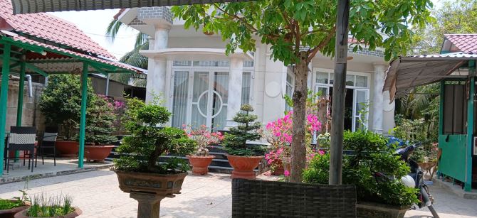 Cần bán Lô đất 2.400 tặng căn BIỆT THỰ SANG TRỌNG sát DT 870 dẫn Cầu Rạch miễu2.TG - 1