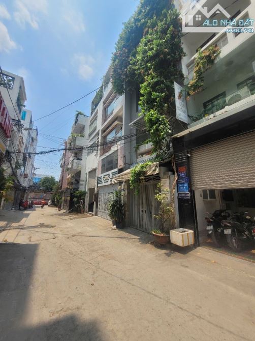 Hẻm xe tải phan văn trị ngang 8m 4 tầng có thang máy dòng tiền 65tr/tháng