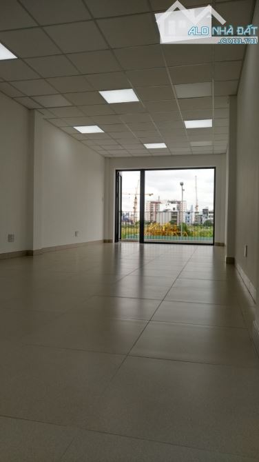 Toà nhà văn phòng 4x20m, hầm 4 tầng sàn trống ngay Lương Định Của, P. An Phú - 4