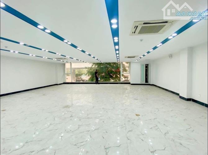 BÁN TOÀ VĂN PHÒNG MẶT PHỐ PHẠM VĂN ĐỒNG 200m2 - 8T THANG MÁY -MT 11m - 125 TỶ - KINH DOANH - 1