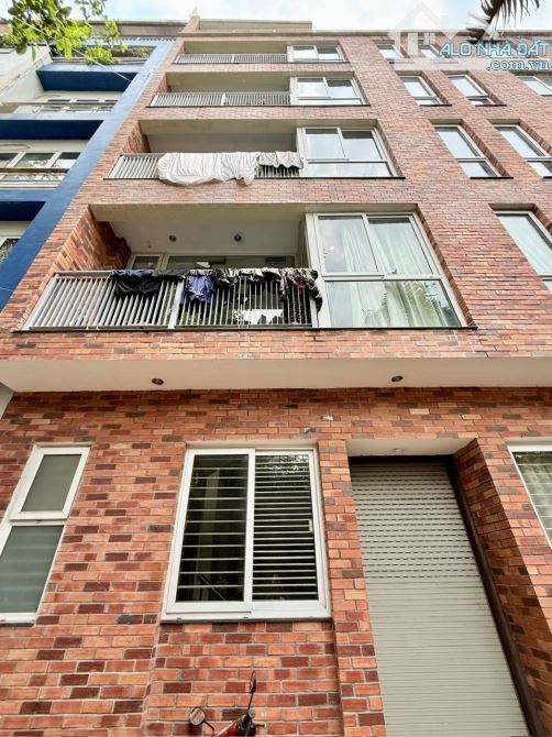 Bán Tòa  APARTMENT Xuân Diệu lô góc thang máy, Dt 75m2, mt 14m, ô tô đỗ cửa.