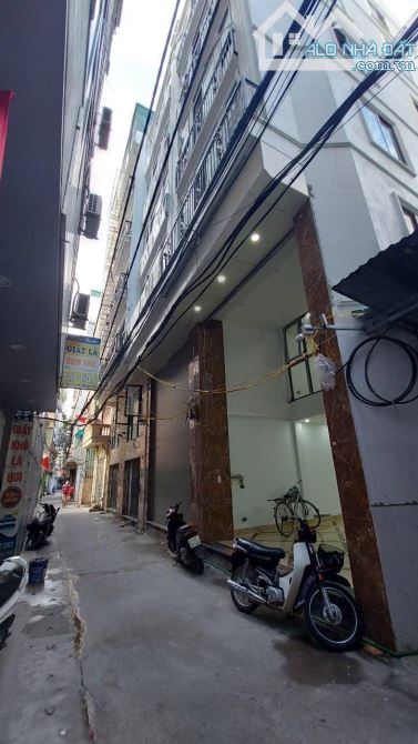 BÁN NHÀ MẶT NGÕ 387 ĐƯỜNG VŨ TÔNG PHAN. 60M2 - 7 TẦNG. THANG MÁY. NHÀ MỚI.