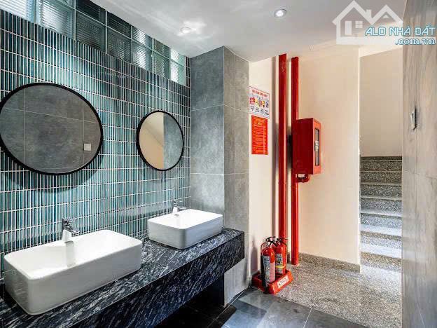Tòa VP 7 tầng 54/3 Đào Duy Anh – DT 12x13 121m², HĐ thuê 110tr/tháng – giá chỉ 37 tỷ TL - 1