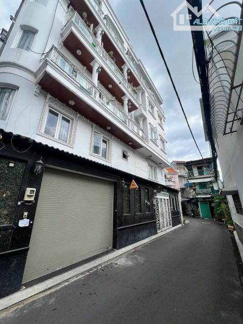 BÁN NHÀ, đường Đặng Văn Ngữ, Q. Phú Nhuận, Kc 1Trệt 4 lầu cao cấp  Dt:7 x 9m. Giá 15tỷ900 - 2
