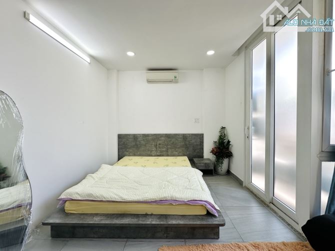 Bán nhà Phú Nhuận - hầm, 7 tầng - nở hậu - thu nhập 1.4 tỷ/năm - 1