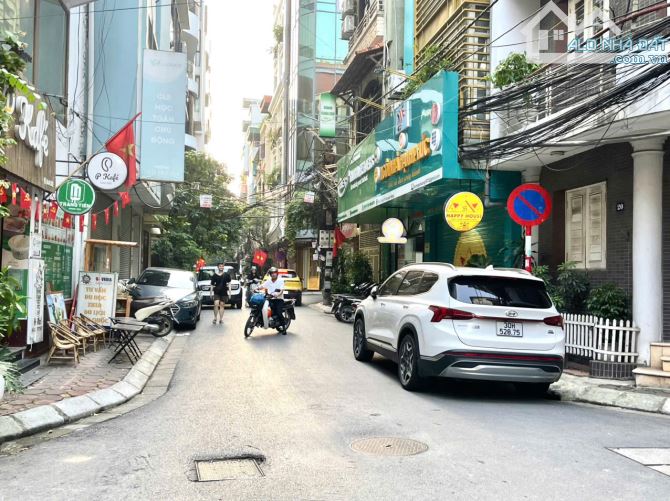 NHÀ MẶT NGÕ LÔ GÓC PHỐ 51 TỶ 75m 5 TẦNG MT 6,9m VỈA HÈ Ô TÔ TRÁNH HUỲNH THÚC KHÁNG ĐỐNG ĐA - 1