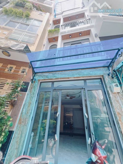 BÁN NHÀ ĐẸP MỚI XÂY KHU VIP ĐƯỜNG SỐ 4 TẤM Q4 XE HƠI ĐỖ CỬA 5PN GIÁ 11T5 TL SÁT MT