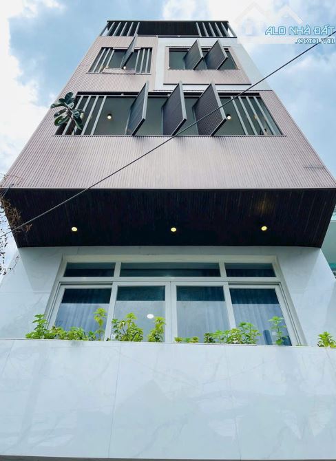 52M² 5Tầng BTCT 4Phòng Ngủ Hẻm Nhựa 5M Xe Hơi Ngủ Nhà