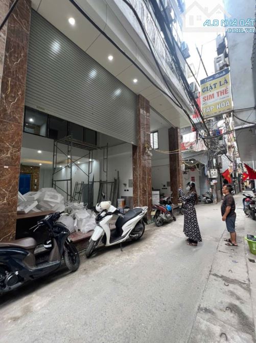 BÁN GẤP NHÀ MẶT NGÕ Ô TÔ ĐƯỜNG VŨ TÔNG PHAN. 65M2 - 7 TẦNG. THANG MÁY.