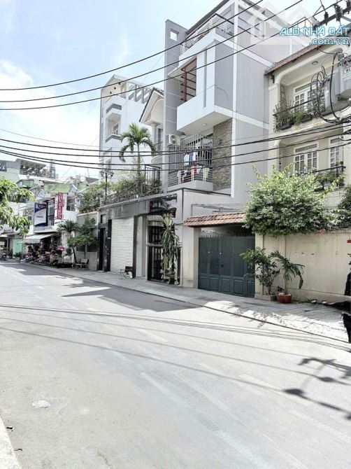 BÁN GẤP TÒA NHÀ DỊCH VỤ NGAY SÂN BAY - HẦM + 5 TẦNG THANG MÁY - 127 M2 - NGANG 6.5M - 1