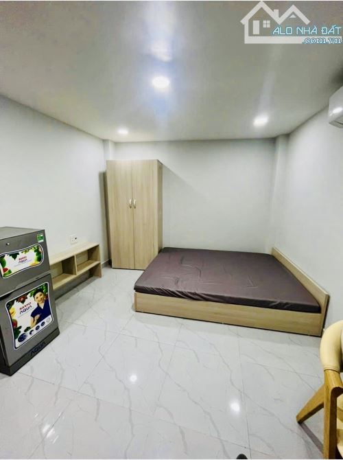 CHDV 13 PHÒNG- LÊ QUANG ĐỊNH- 6 TẦNG- NGANG 5M, NỞ HẬU- 15,x TỶ - 6