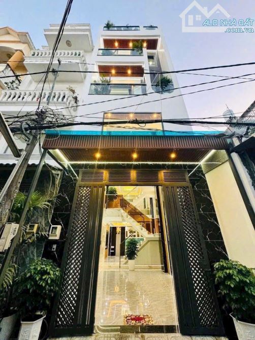 Bán nhà 1/ HẺM XE HƠI_ LÂM THỊ HỐ Q12_ 5 Tầng_tặng FULL NỘI THẤT_ DT sàn 180m2_ 6ty250