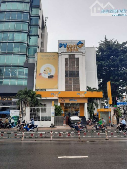 Bán tòa nhà góc 2MT Phan Đăng Lưu P.7 PN, DT 18x18m CN 335m2 Hầm 5 tầng, giá 185 tỷ
