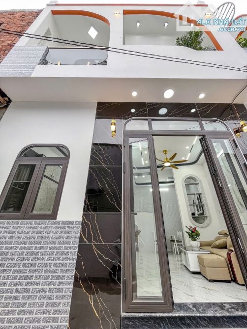 BÁN NHÀ TRỆT LẦU MỚI 100% ĐANG HOÀN THIỆN CÁCH CHỢ AN BÌNH 100M- ĐƯỜNG HOÀNG QUỐC VIỆT - T