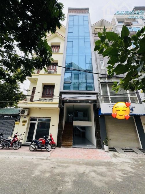 Toà nhà văn phòng 8 tầng xây mới - oto tránh -2 mặt thoáng - phân lô vỉa hè rộng - 2